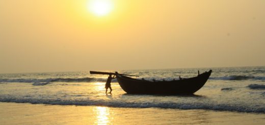 Fisherman and Boat during Sunrise in Sea Beach of Digha, West Bengal, India