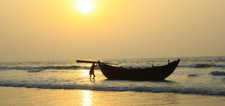 Fisherman and Boat during Sunrise in Sea Beach of Digha, West Bengal, India